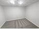 A finished basement space with neutral carpet and recessed lighting at 1935 Wenton Pl, Lawrenceville, GA 30044
