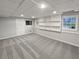 Finished basement features recessed lighting, built-in shelves, and large windows at 1935 Wenton Pl, Lawrenceville, GA 30044