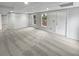 Finished basement with neutral carpet and an exterior door at 1935 Wenton Pl, Lawrenceville, GA 30044