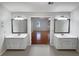 Bathroom featuring dual vanities with a view into the bedroom at 1935 Wenton Pl, Lawrenceville, GA 30044