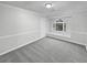 The room features crown molding, wainscotting, and a charming arched window seat at 1935 Wenton Pl, Lawrenceville, GA 30044