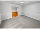 Bedroom boasts hardwood floors, and wainscotting, perfect for hosting guests at 1935 Wenton Pl, Lawrenceville, GA 30044