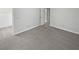 Spacious bedroom with neutral carpet leading to closet and en suite bathroom at 1935 Wenton Pl, Lawrenceville, GA 30044