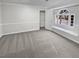 Bedroom with neutral carpet, a large window seat, and closet access at 1935 Wenton Pl, Lawrenceville, GA 30044