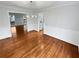 Dining room showcases gleaming hardwood floors, white trim, and a modern chandelier at 1935 Wenton Pl, Lawrenceville, GA 30044