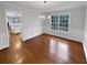 Bright dining area with hardwood floors and elegant chandelier at 1935 Wenton Pl, Lawrenceville, GA 30044