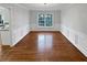 Bright dining room features hardwood floors, wainscoting, and a chandelier at 1935 Wenton Pl, Lawrenceville, GA 30044