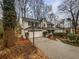 Charming two-story home with a two-car garage, basketball hoop, and driveway at 1935 Wenton Pl, Lawrenceville, GA 30044
