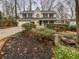 Charming two-story home with a well-manicured front yard and welcoming front porch at 1935 Wenton Pl, Lawrenceville, GA 30044