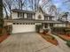Charming two-story home with a two-car garage and a well-maintained front yard at 1935 Wenton Pl, Lawrenceville, GA 30044