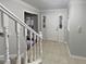 Entryway featuring tiled flooring, a staircase, and a front door with sidelights at 1935 Wenton Pl, Lawrenceville, GA 30044