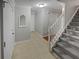 Bright foyer with tiled floors, a staircase, and access to multiple rooms at 1935 Wenton Pl, Lawrenceville, GA 30044