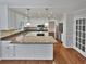 Well-lit kitchen with granite countertops, white cabinets, and stainless steel appliances at 1935 Wenton Pl, Lawrenceville, GA 30044