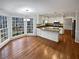 Eat-in kitchen with granite countertops, modern appliances, and a view of the wooded yard at 1935 Wenton Pl, Lawrenceville, GA 30044