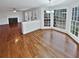 Open view from eat-in kitchen to the living room, with hardwood floors throughout at 1935 Wenton Pl, Lawrenceville, GA 30044