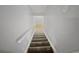 Carpeted stairs leading to another level of the home at 1935 Wenton Pl, Lawrenceville, GA 30044