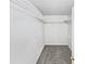 Walk-in closet featuring ample shelving that provides excellent storage and organization at 1935 Wenton Pl, Lawrenceville, GA 30044