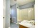 Functional bathroom with a shower-tub combo, tiled flooring, and a single sink vanity at 2194 Highway 20 E., Mcdonough, GA 30252