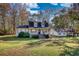 Charming home with dormer windows, a covered porch, and a well-maintained front yard at 2194 Highway 20 E., Mcdonough, GA 30252
