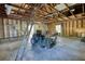 Organized garage space with a concrete floor, equipment, and overhead lighting at 2194 Highway 20 E., Mcdonough, GA 30252