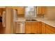 Functional kitchen with stainless steel appliances, tile backsplash, and wooden cabinets at 2194 Highway 20 E., Mcdonough, GA 30252