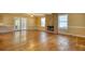 Spacious living room with hardwood floors, stone fireplace, and ample natural light at 2194 Highway 20 E., Mcdonough, GA 30252