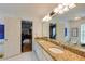 Spacious bathroom featuring a large vanity with double sinks and granite countertops at 4500 Candacraig, Johns Creek, GA 30022