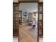 Living room with bookshelves features neutral colors, a window, and comfortable chairs at 4500 Candacraig, Alpharetta, GA 30022