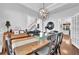 Dining room with hardwood floors, view of staircase, and lots of open space at 5570 Saddle Tree Ct, Sugar Hill, GA 30518