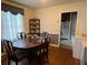 Cozy dining room featuring hardwood floors and classic furnishings adjacent to the kitchen at 804 Maynard Ter, Atlanta, GA 30316