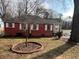 Charming red brick home with a manicured lawn and mature tree in the front yard at 804 Maynard Ter, Atlanta, GA 30316