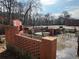 Outdoor brick kitchen area with built-in features, perfect for backyard entertaining and BBQs at 804 Maynard Ter, Atlanta, GA 30316