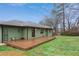 Backyard featuring a wood deck, green lawn, and a shed, perfect for outdoor enjoyment and storage at 1322 Elmhurst Circle Se Cir, Atlanta, GA 30316