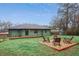 Backyard showcasing a fire pit with seating, green lawn, and a shed, ideal for outdoor gatherings at 1322 Elmhurst Circle Se Cir, Atlanta, GA 30316