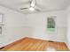 Bright bedroom with hardwood floors, ceiling fan, and natural light streaming through the window at 1322 Elmhurst Circle Se Cir, Atlanta, GA 30316