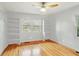 Bright bedroom with hardwood floors, built-in shelving, and plenty of natural light at 1322 Elmhurst Circle Se Cir, Atlanta, GA 30316