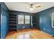 Stylish bedroom featuring built-in shelves and ample natural light through multiple windows at 1322 Elmhurst Circle Se Cir, Atlanta, GA 30316