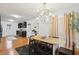 Well-lit dining room with a chandelier, gray walls, and easy access to the kitchen, perfect for everyday dining and gatherings at 1322 Elmhurst Circle Se Cir, Atlanta, GA 30316