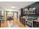 This eat-in kitchen features stainless steel appliances and dark wood cabinets at 1322 Elmhurst Circle Se Cir, Atlanta, GA 30316