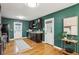 Stylish kitchen with dark cabinetry, green walls, and an adjacent door to the outdoors, blending indoor and outdoor living at 1322 Elmhurst Circle Se Cir, Atlanta, GA 30316