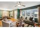 Inviting living room with hardwood floors, large windows, and view of the dining room at 1322 Elmhurst Circle Se Cir, Atlanta, GA 30316