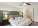 Comfortable main bedroom with neutral tones, wooden floors, and a ceiling fan at 1322 Elmhurst Circle Se Cir, Atlanta, GA 30316