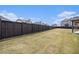 Expansive backyard featuring a privacy fence and well-maintained lawn at 3815 Beaver Swamp Rd, Loganville, GA 30052