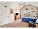 Cozy bedroom featuring vaulted ceiling, ceiling fan, and a window with neighborhood views at 3815 Beaver Swamp Rd, Loganville, GA 30052