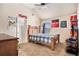 Bedroom featuring a bed with wooden frame, carpeted floors and a window with blinds at 3815 Beaver Swamp Rd, Loganville, GA 30052