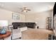 Spacious living room offers a dark leather sectional and large area rug at 3815 Beaver Swamp Rd, Loganville, GA 30052