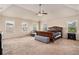 Expansive main bedroom features a ceiling fan and lots of natural light at 3815 Beaver Swamp Rd, Loganville, GA 30052