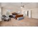 Large main bedroom suite featuring a ceiling fan, lots of natural light, and sitting area at 3815 Beaver Swamp Rd, Loganville, GA 30052