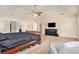 Bright main bedroom featuring lots of space, a ceiling fan, and an entertainment center at 3815 Beaver Swamp Rd, Loganville, GA 30052