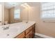 Well-lit bathroom featuring double sinks and a large mirror at 4900 Raquet Ct, Duluth, GA 30096